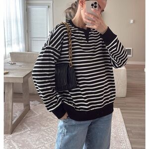 Free people inspired sweatshirt.  Tag says L   feels like a M. Look at video.